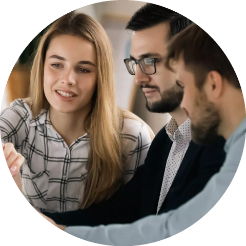 Colleagues discuss company financial paperwork together. Colleagues discuss company financial paperwork together.