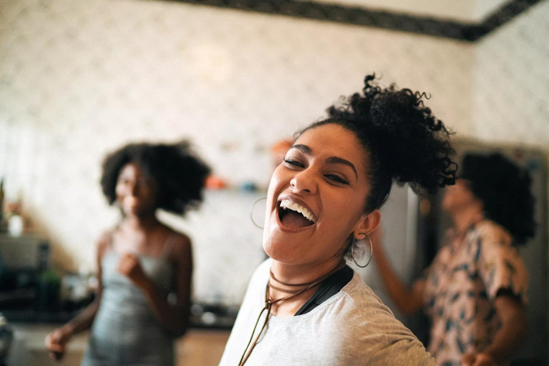 Friends dancing and having fun in kitchen. Friends dancing and having fun in kitchen.
