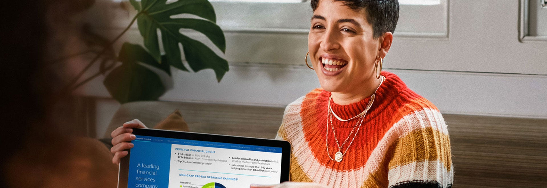 Hispanic woman is sharing computer graphics with her team