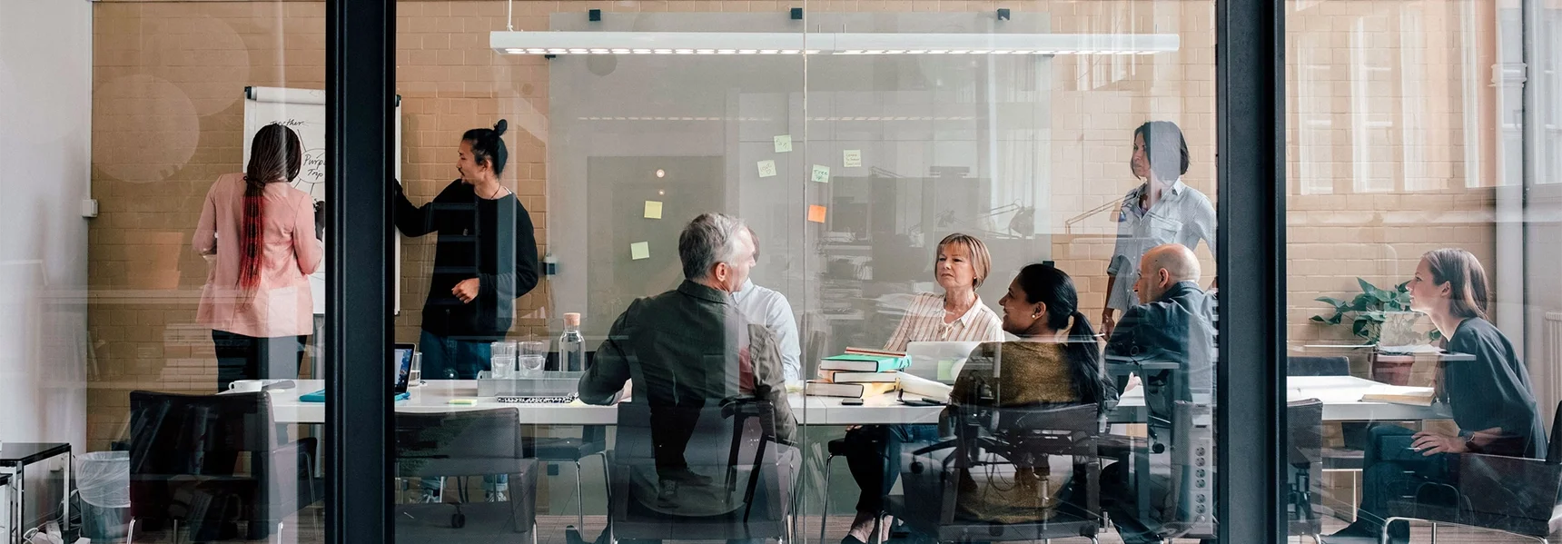 Employees gathered in a conference room to collaborate.