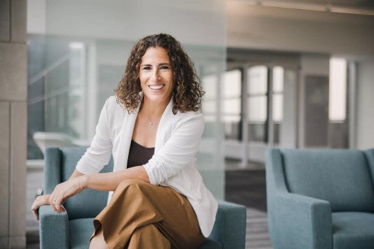 Kimberly Etchings posing at the Principal headquarters.