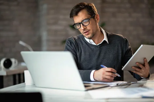 A man working in an office setting.