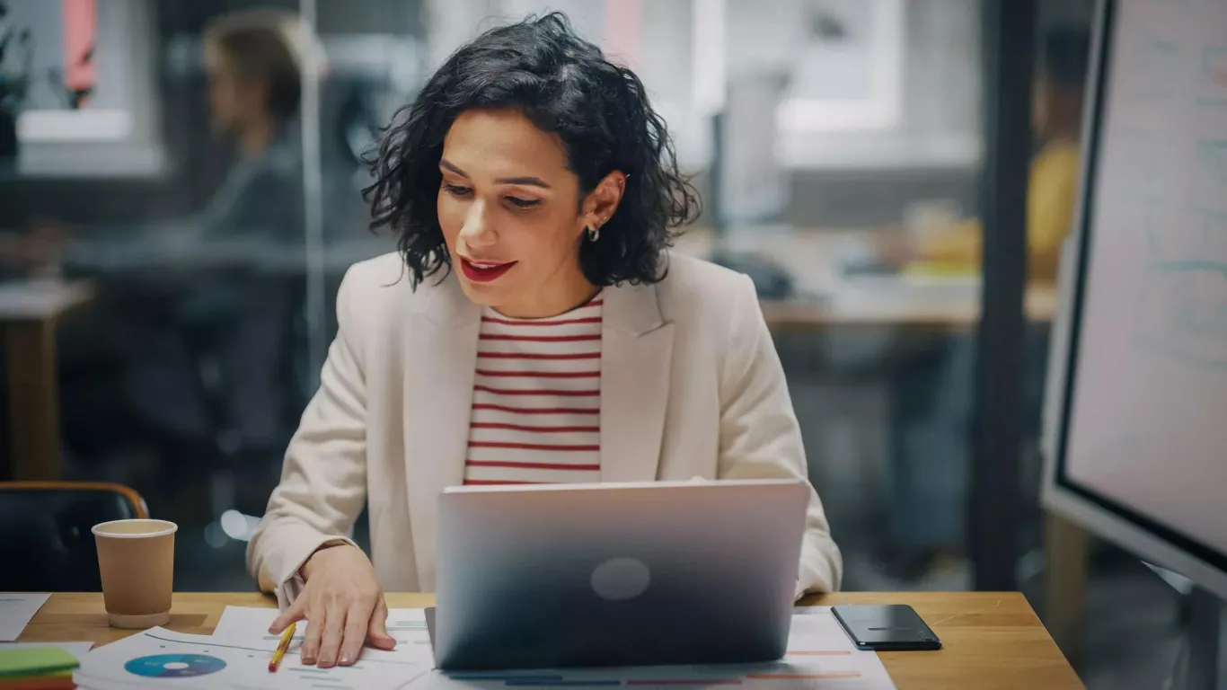A woman reviewing her finances to consider hiring a TPA