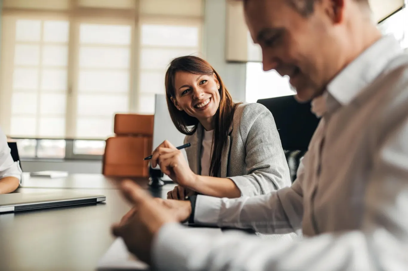 A woman smiling while meeting with a TPA
