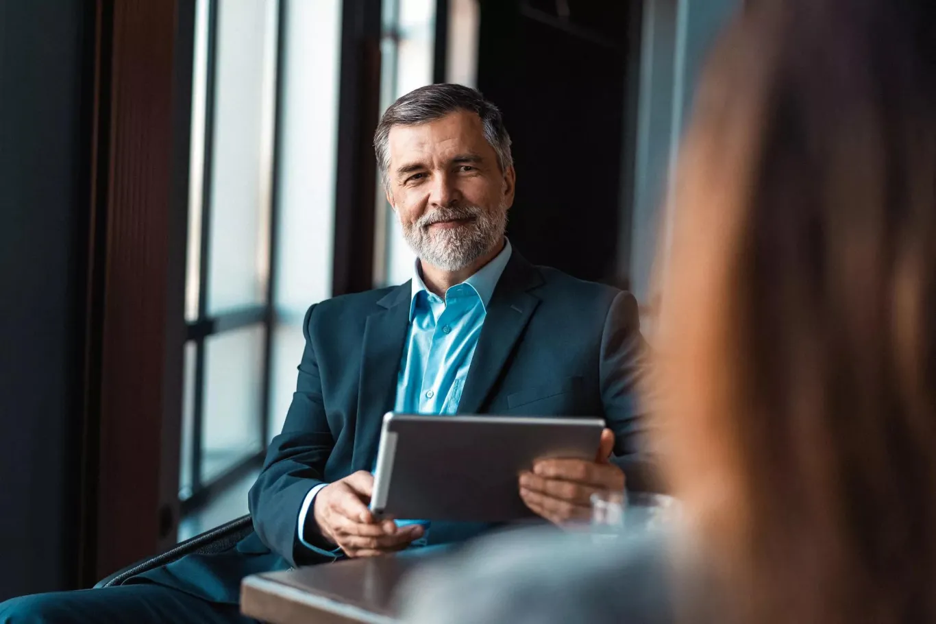 Man at a desk in an office setting Man at a desk in an office setting