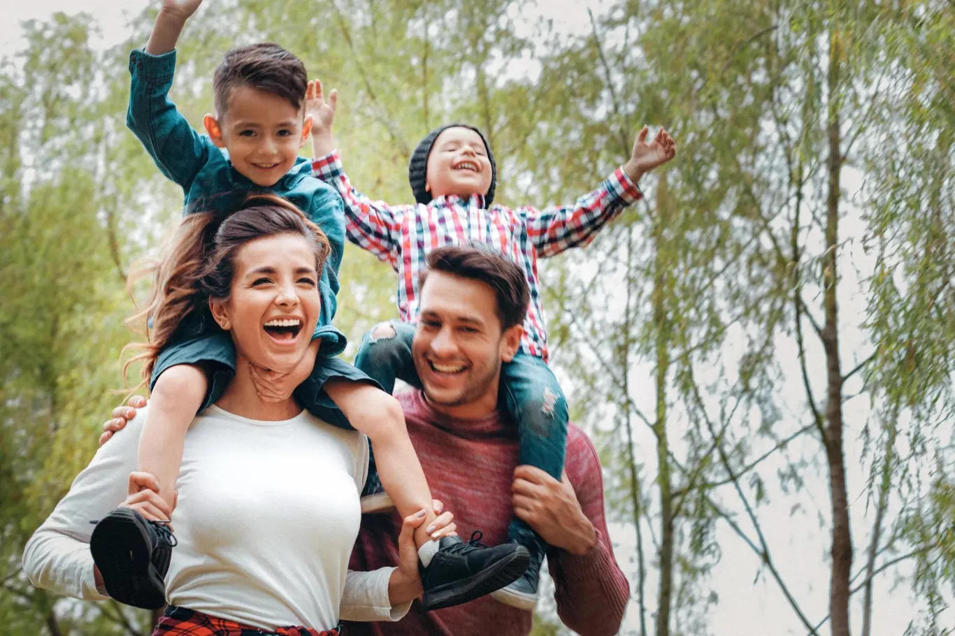 Active family of four enjoying a walk outdoors.