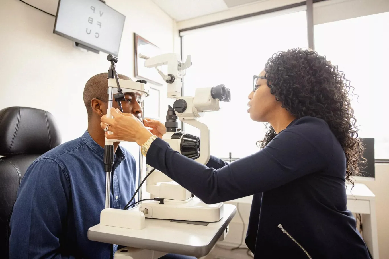 A man having a vision care exam at the eye doctor.