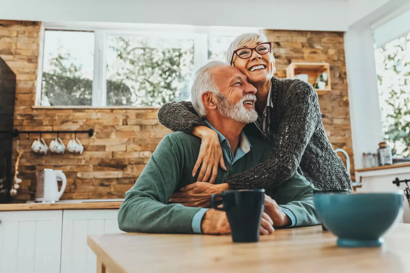 A husband and wife embracing each other