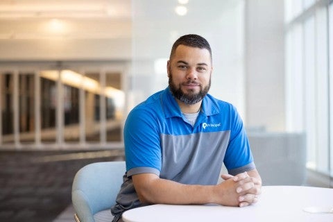 Principal employee Micah Greene, an Air National Guard member.