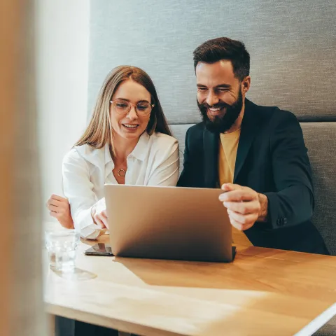 Business partners look over their finances to determine if a TPA is right for their business.