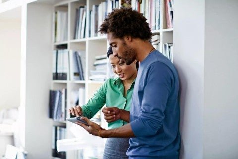 Couple with tablet.