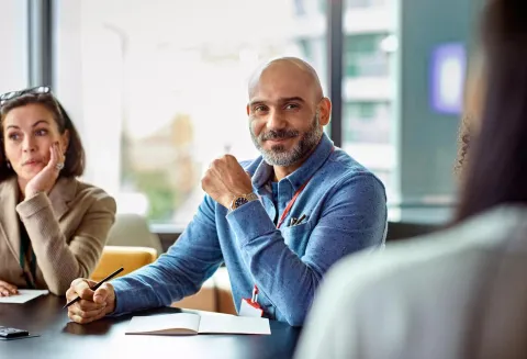 Man in meeting.