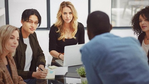 Employees discussing award winning strategies Employees discussing award winning strategies