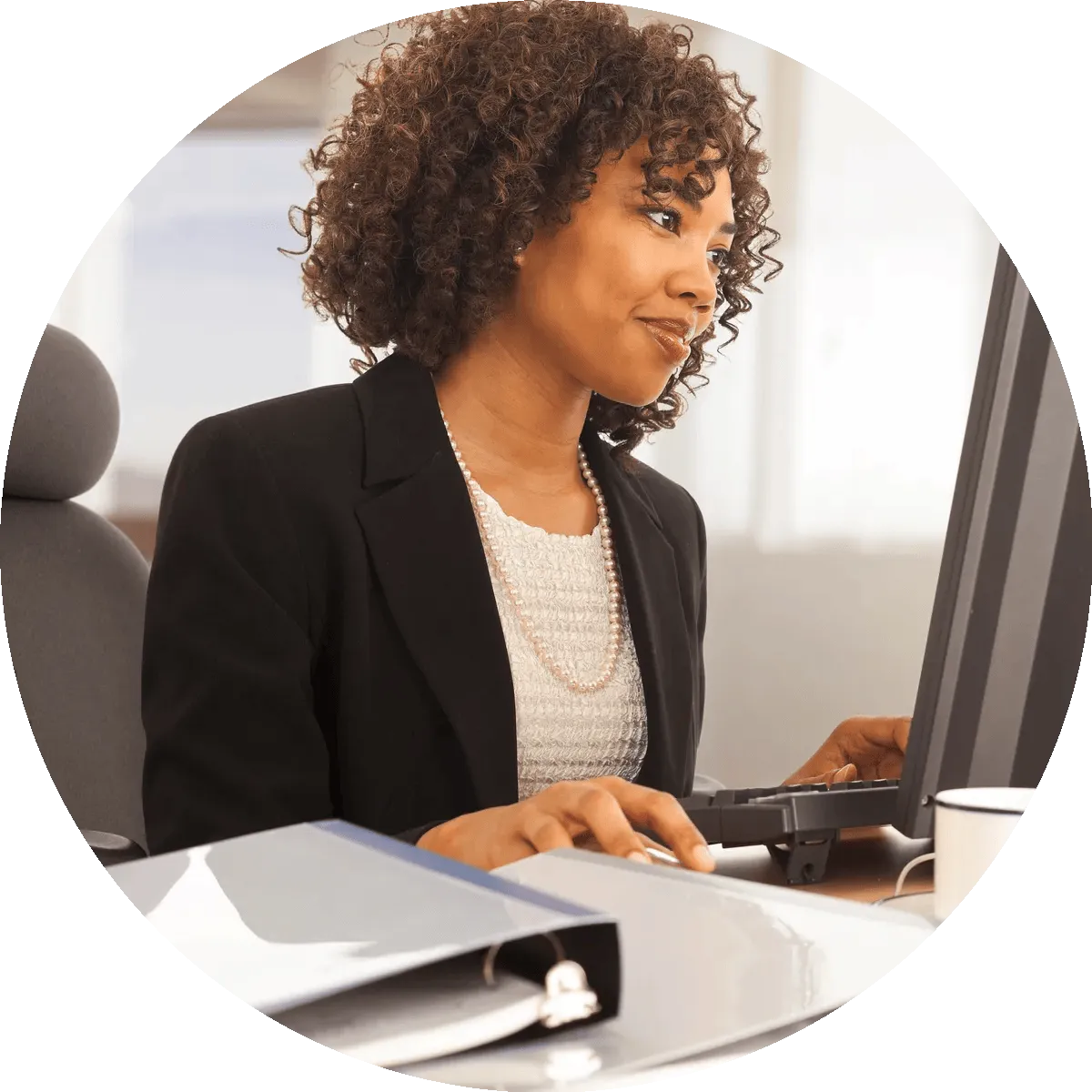 A woman working at her computer.