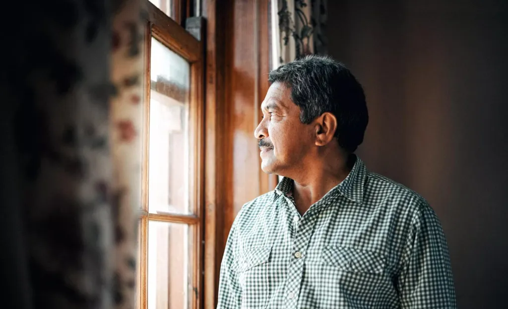 A man looking out the window.