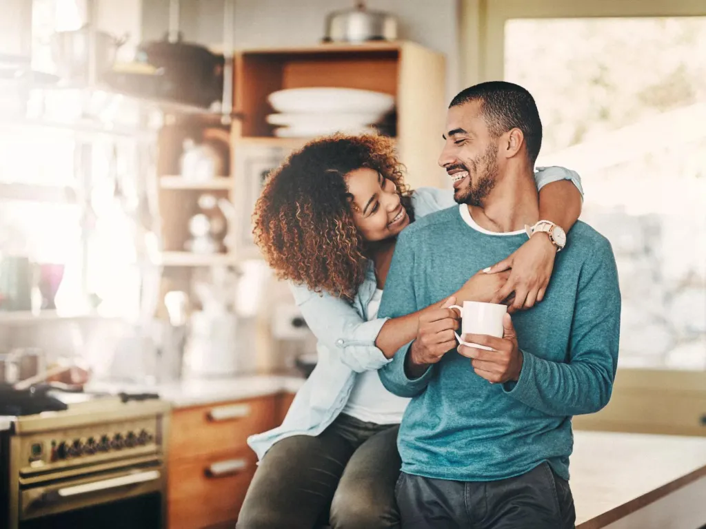 Smiling couple who are grateful they purchased voluntary employee life insurance to protect their future.