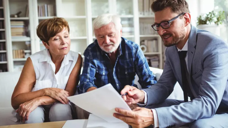 Couple nearing retirement discussing retirement income with financial professional