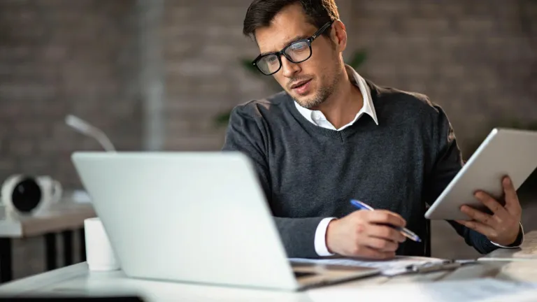A man working in an office setting.
