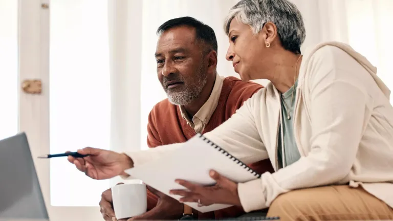 Mature man and woman going over their finances.