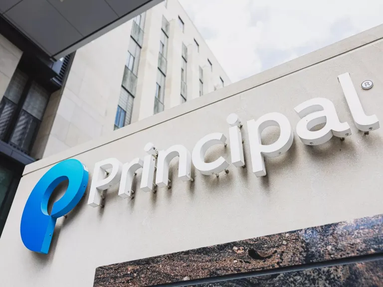 An upward view of the Principal Financial Group campus exterior signage.