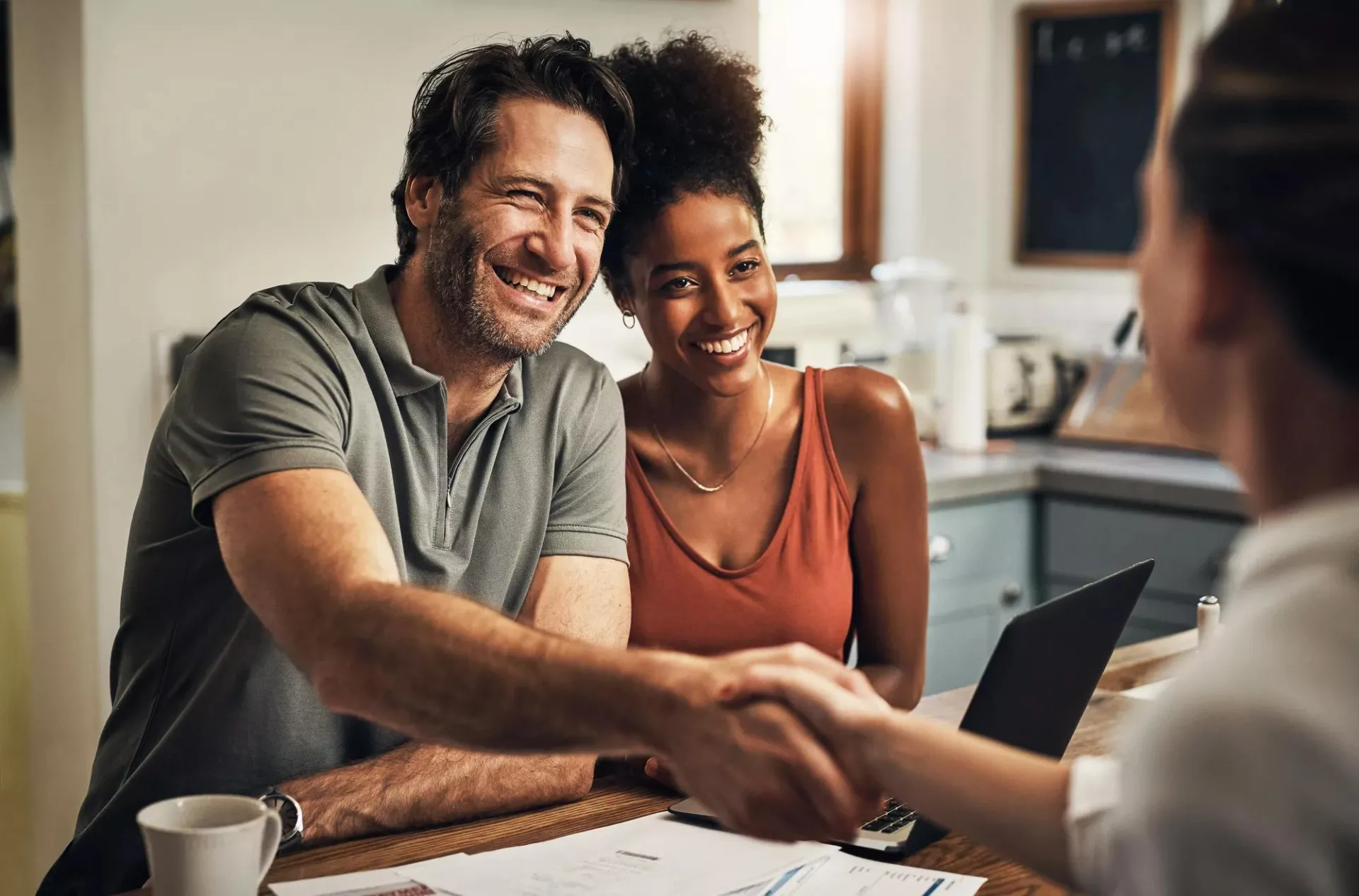A husband and wife meeting with a financial advisor.