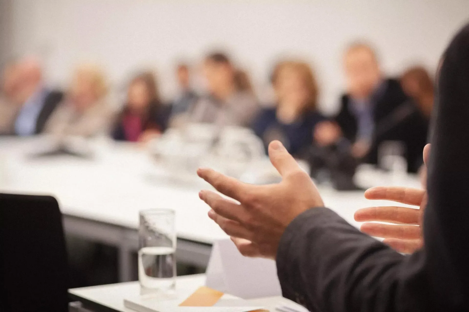 A man presenting in a conference room