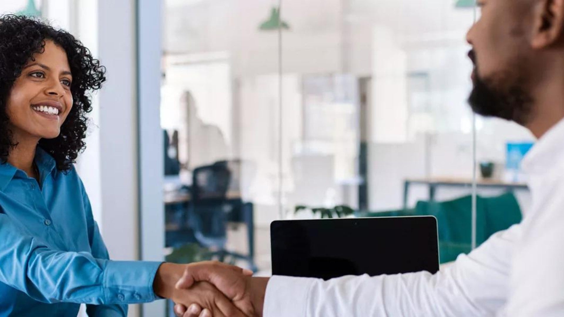 Photo of small business owner able to attract and retain an employee.
