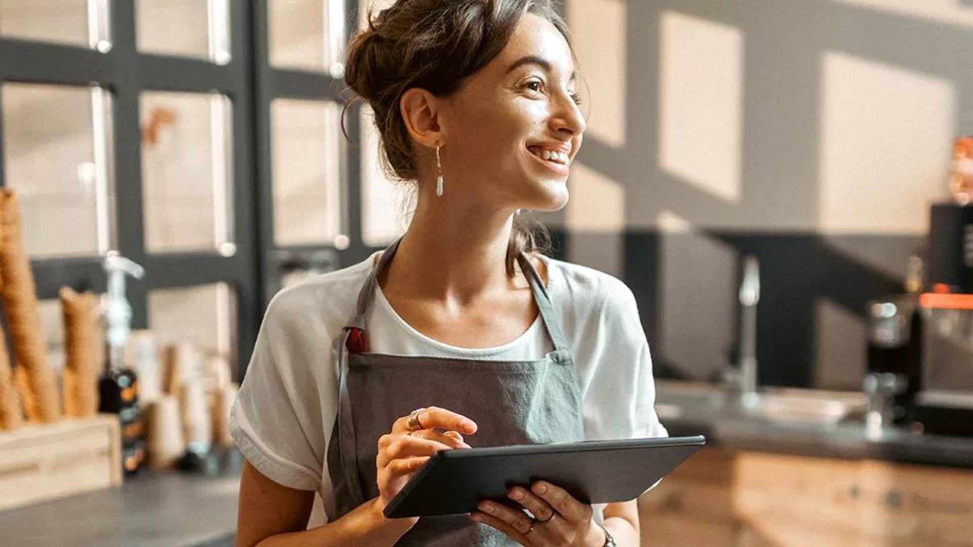 Photo of a businesswoman holding a tablet.