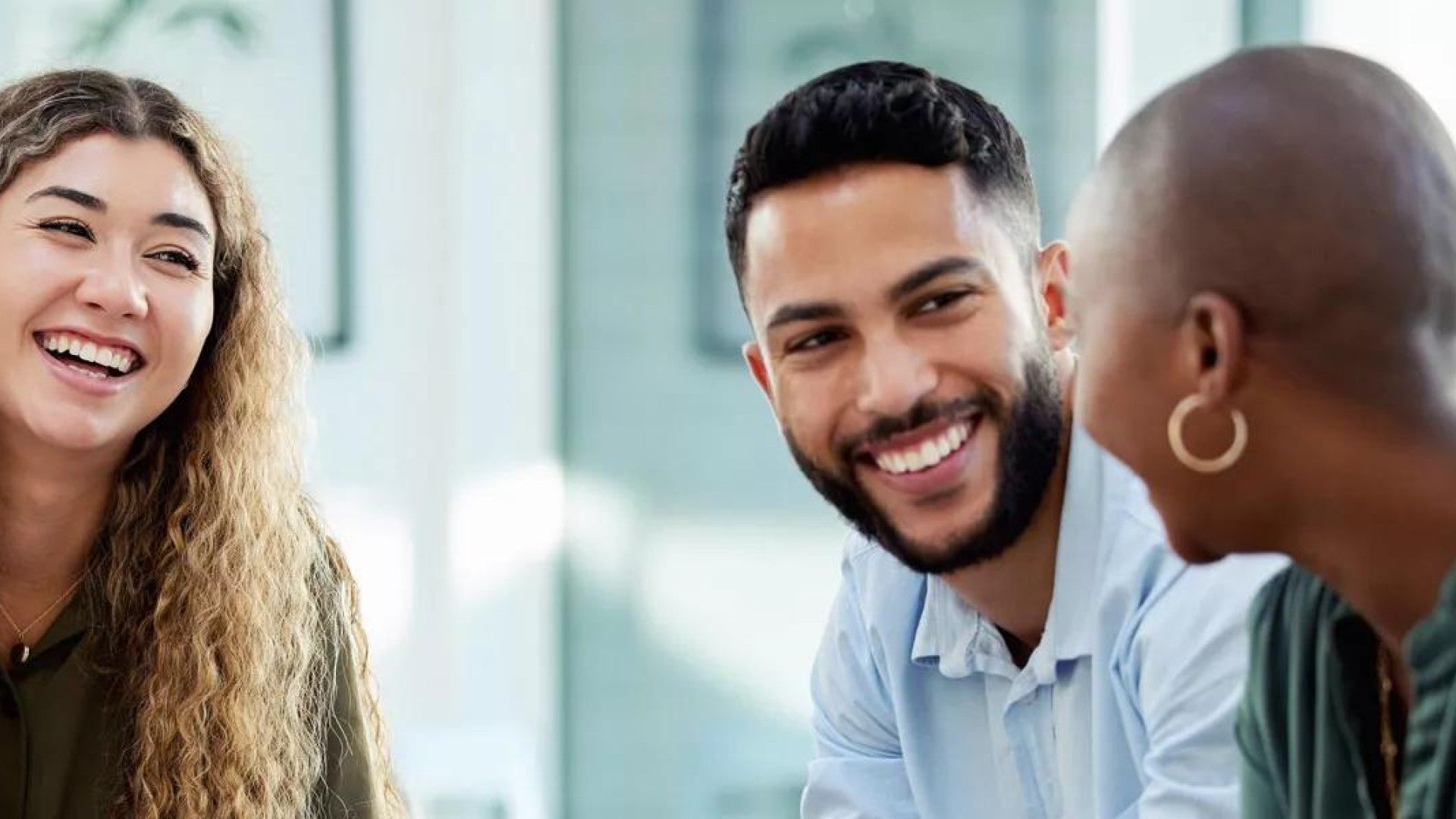Business people smile during a planning meeting.