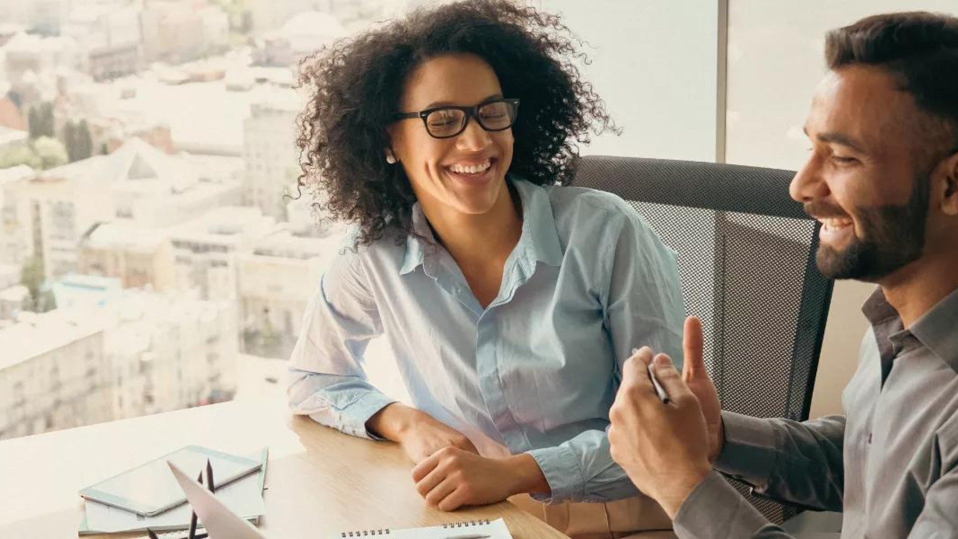 Two employees discussing what they think of their jobs.