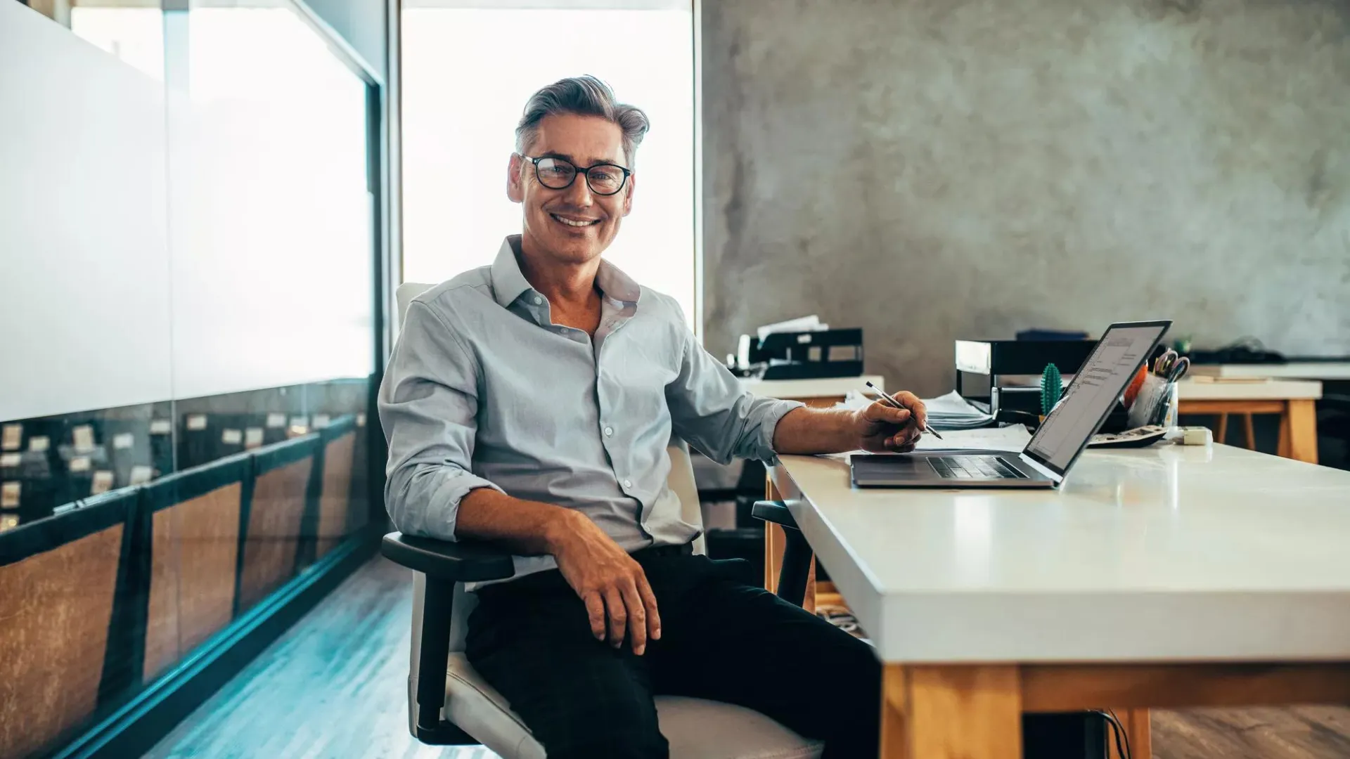 Man in office with laptop