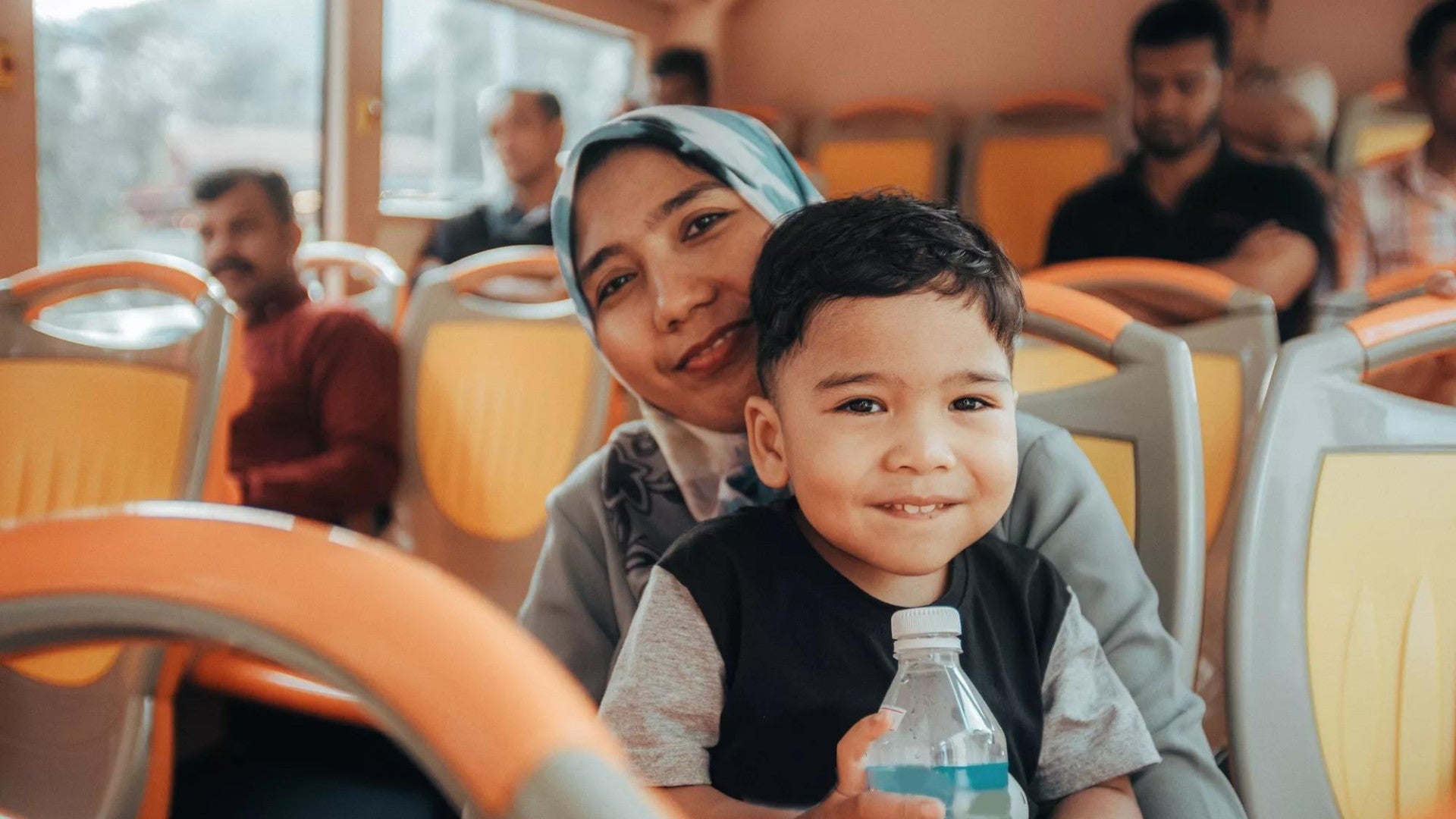 Mother and toddler son in a bus