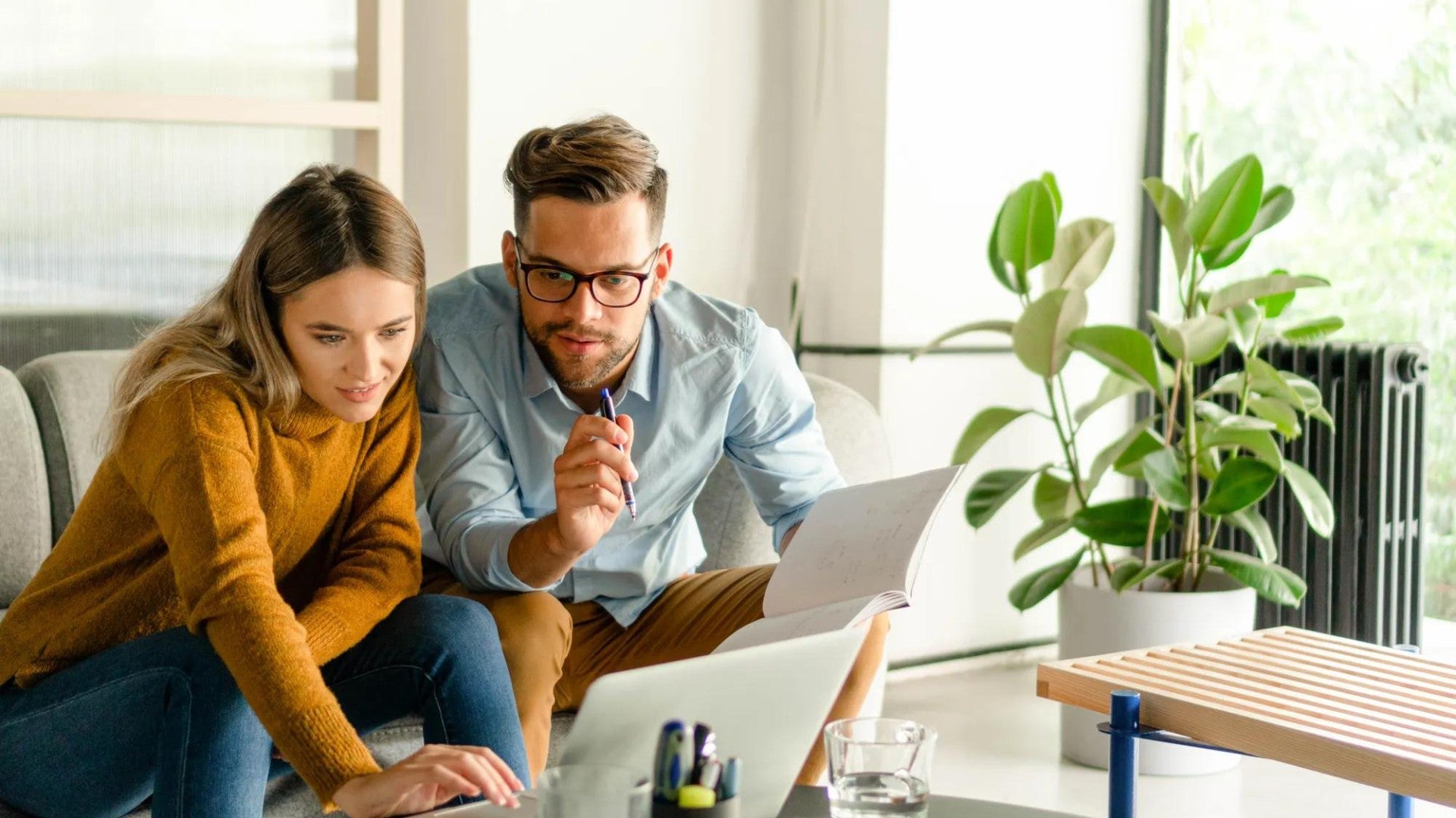 Man and woman reviewing finances on a computer.