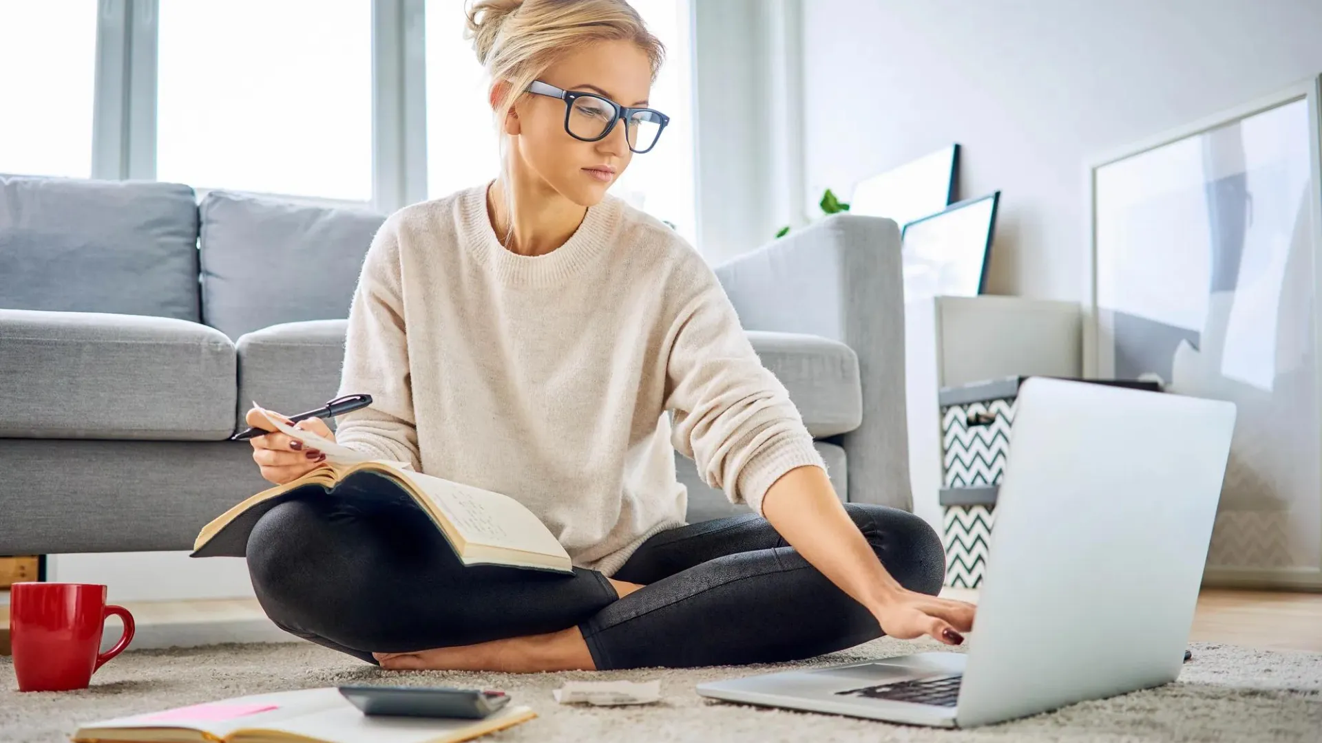  Young woman working on budget and retirement plans on computer 