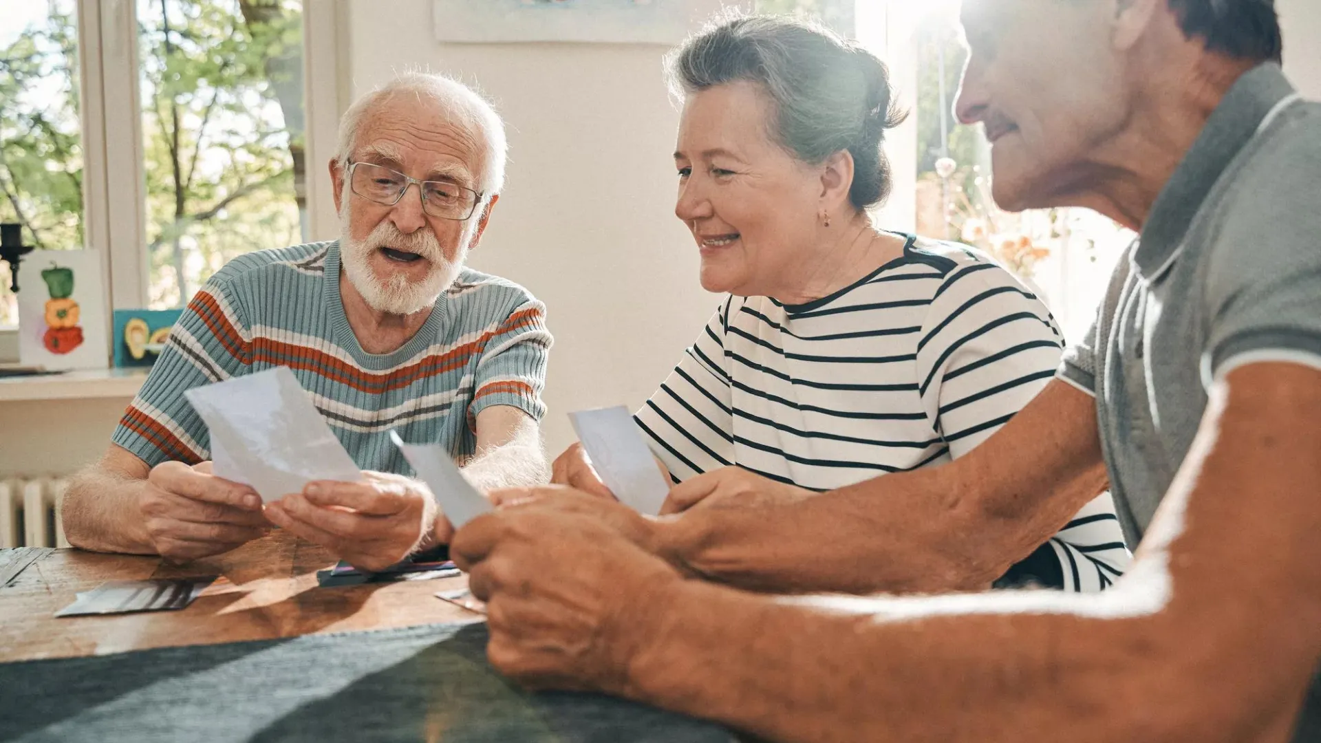 Older couple reviewing paperwork with family member.