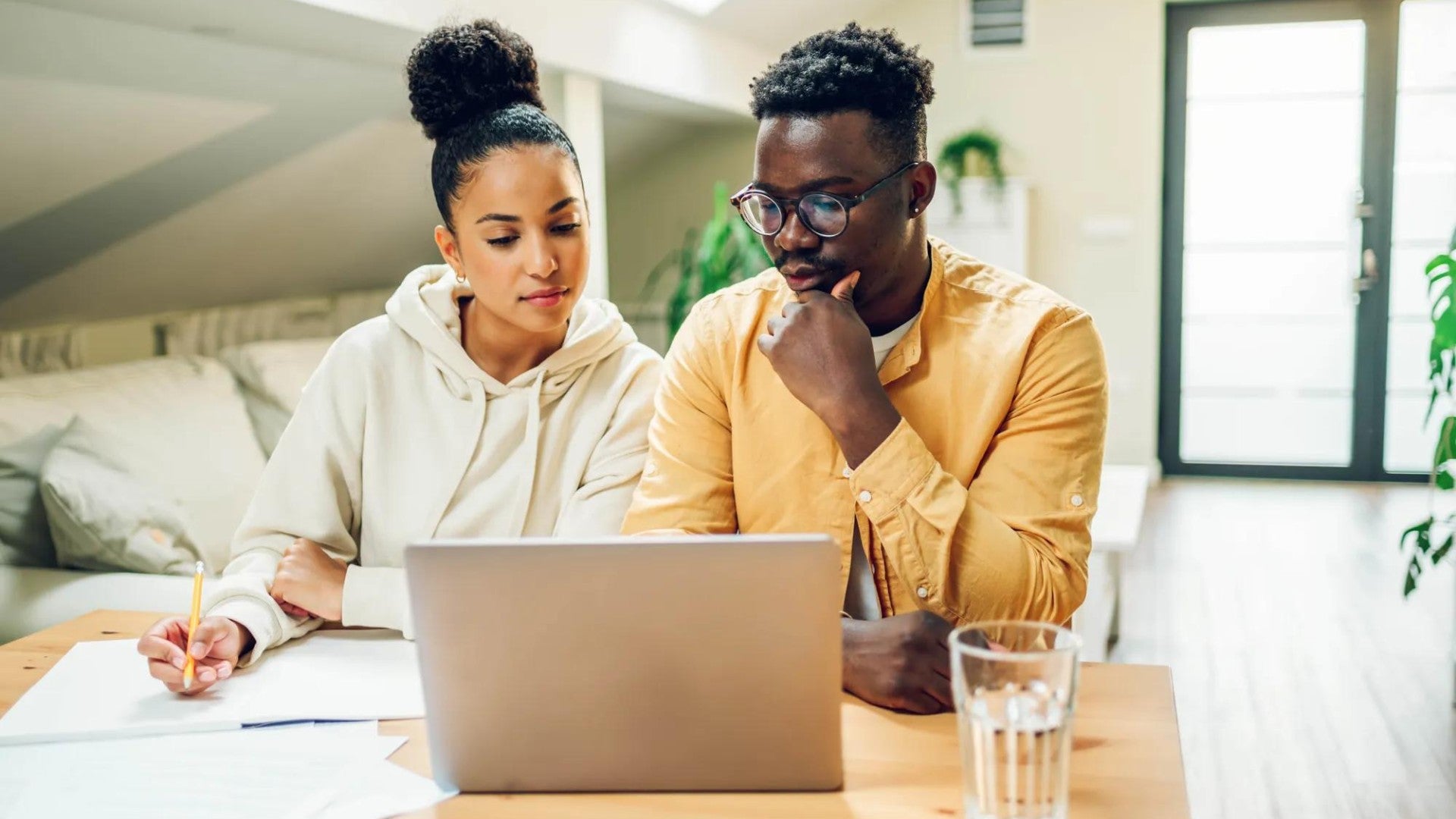 Man and woman reviewing finances at a computer