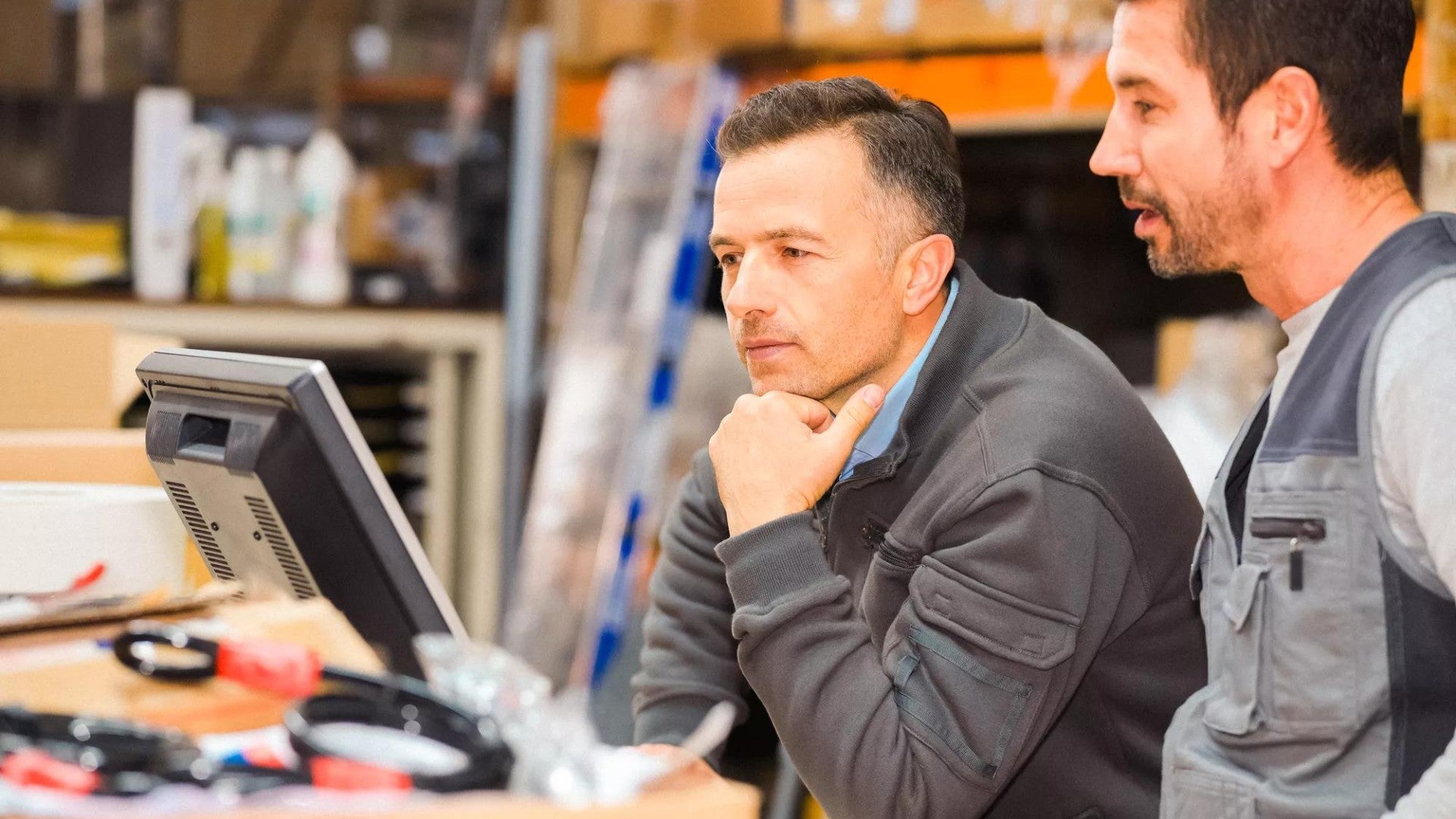 Two small business owners discussing benefits for their employees