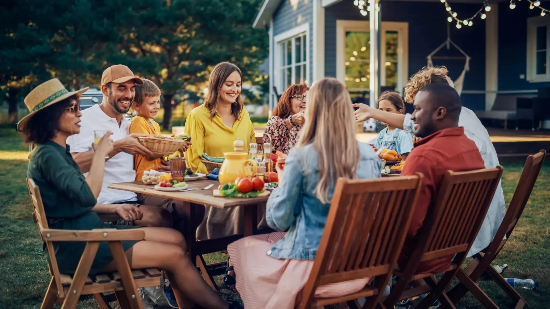 A family eating in their backyard.