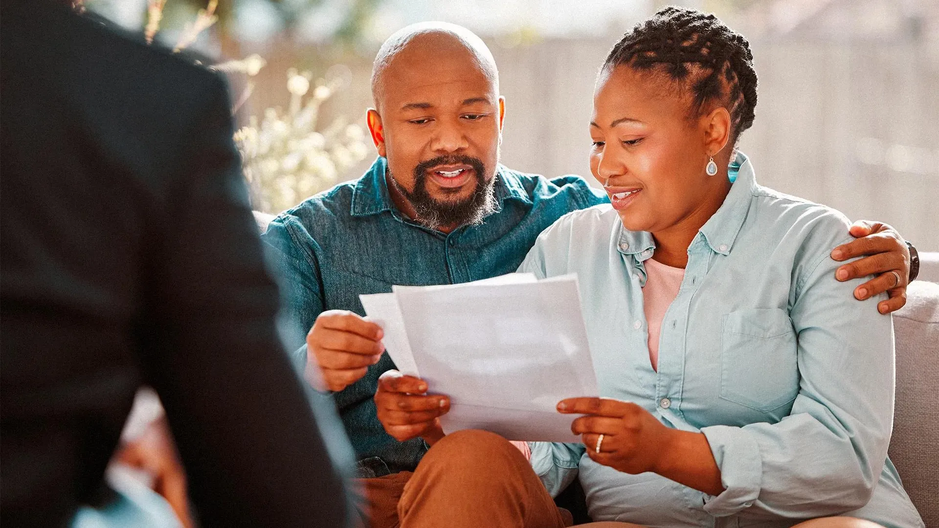 Man and woman reviewing mortgage information.