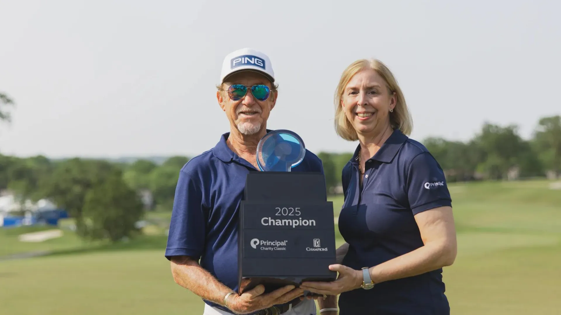 Deanna Strable with the Principal Charity Golf Classic champion, Miguel Angel Jimenez 