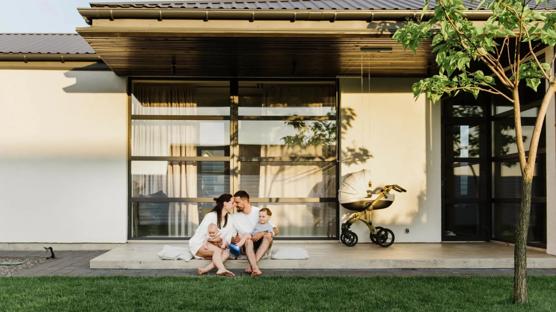 A man and woman sitting in a backyard setting.