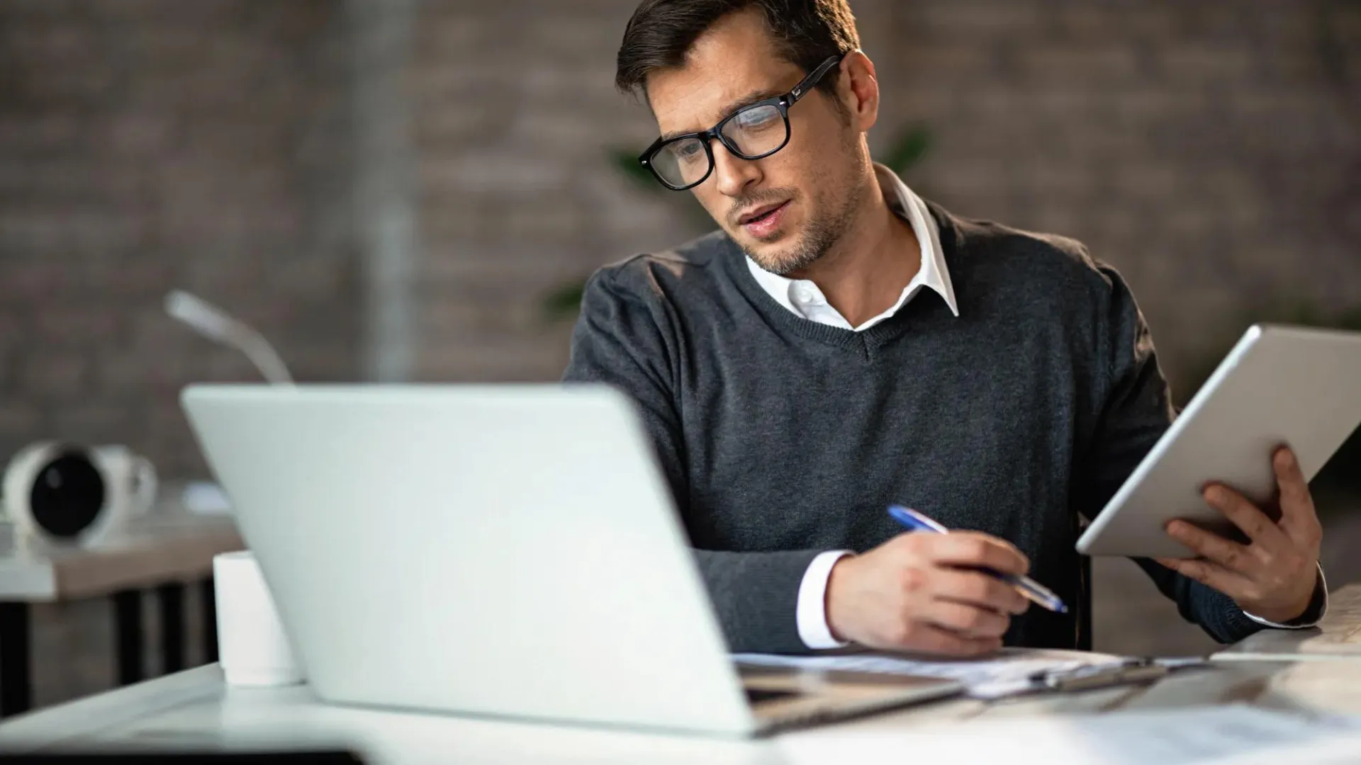 A man working in an office setting.