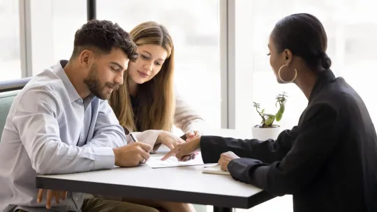 A couple working with a financial professional.