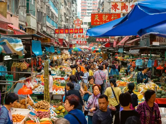 A busy street produce market in Hong Kong, China.