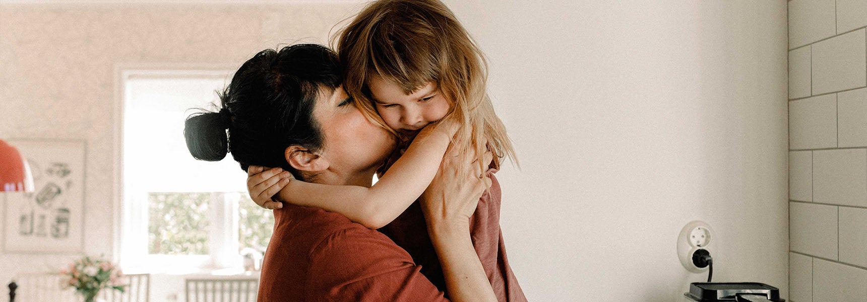 Photo of a woman with a young child.