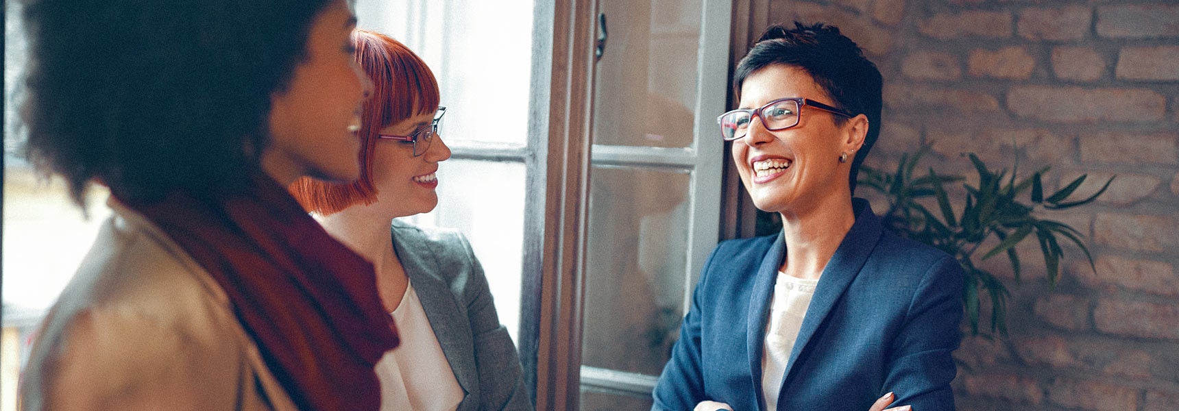 Photo of women talking about ways to save for retirement.