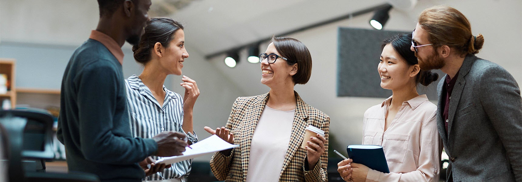 Photo of a group of coworkers discussing a communicaiton plan.