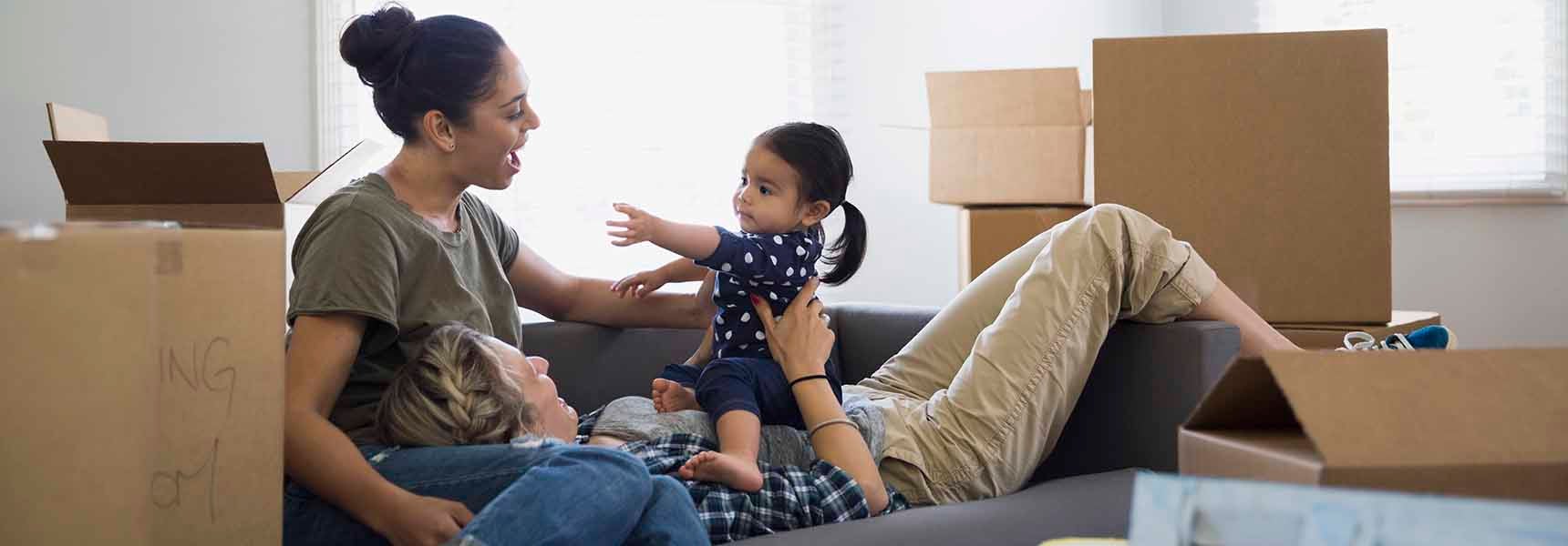 Photo of a family who is moving into their new home.