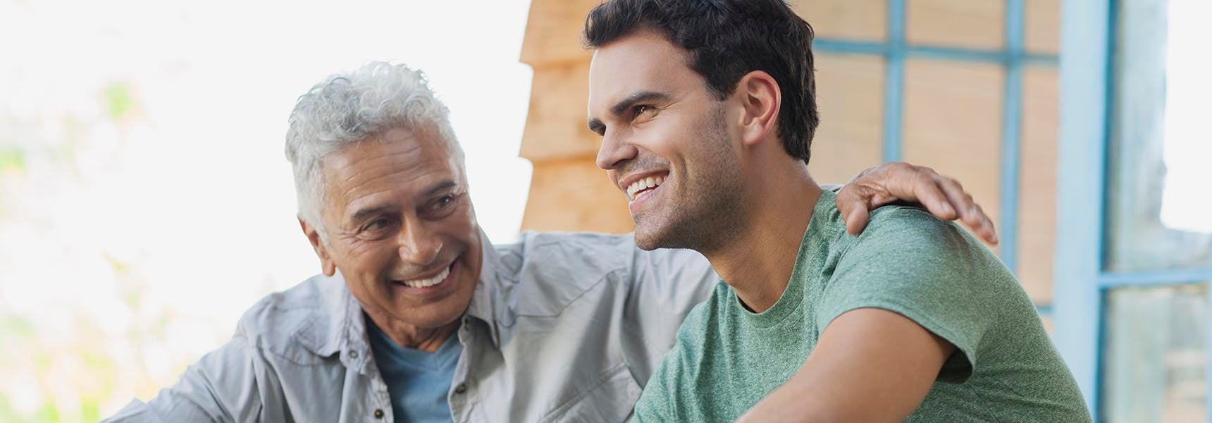 Photo of a man talking with his son about required minimum distributions. Photo of a man talking with his son about required minimum distributions.