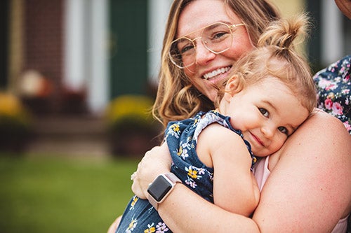 Photo of Ariana Schleisman holding her daughter Georgia. Photo of Ariana Schleisman holding her daughter Georgia.